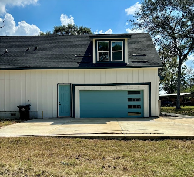 garage with a yard