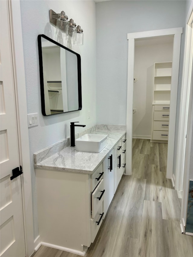 bathroom with vanity and hardwood / wood-style floors