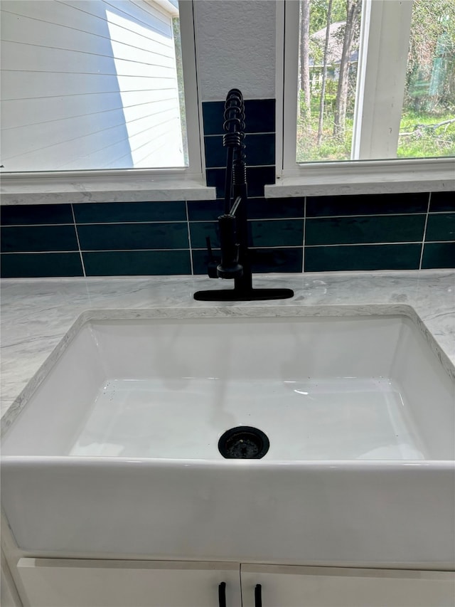 interior details with light stone counters and sink