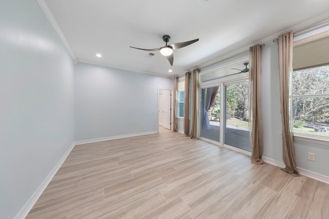 unfurnished room featuring ceiling fan, a healthy amount of sunlight, ornamental molding, and light hardwood / wood-style flooring