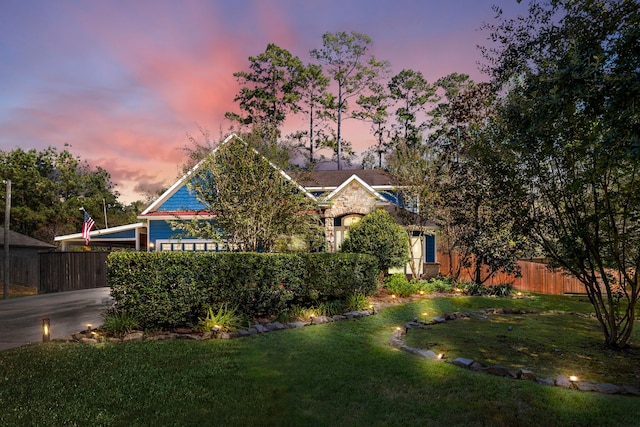 obstructed view of property with a lawn