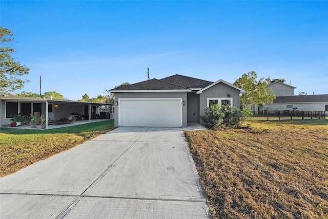 single story home with a front yard and a garage