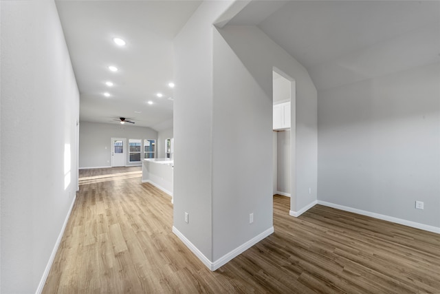 interior space featuring lofted ceiling and light wood-type flooring