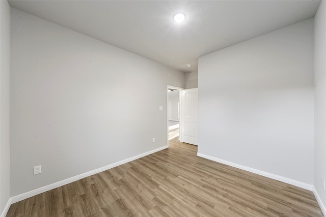 empty room with light wood-type flooring