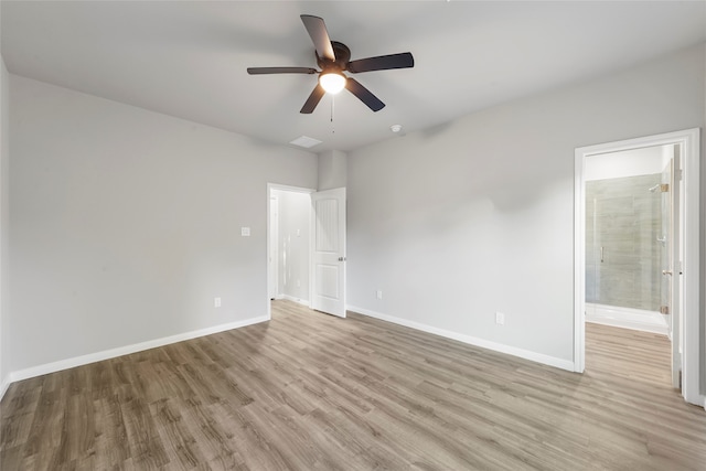 spare room featuring ceiling fan and light hardwood / wood-style flooring