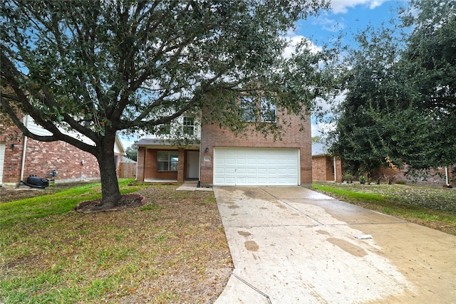 view of front facade featuring a front lawn and a garage