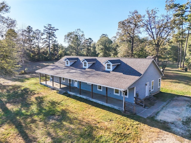 view of front of house with a porch and a front lawn