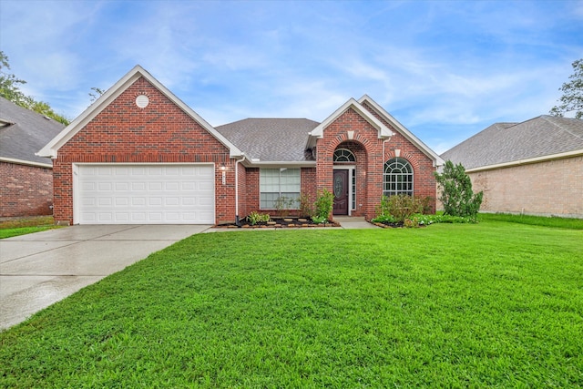 front facade featuring a front yard and a garage