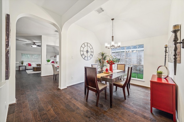 dining space with dark hardwood / wood-style floors, ceiling fan with notable chandelier, and a wealth of natural light