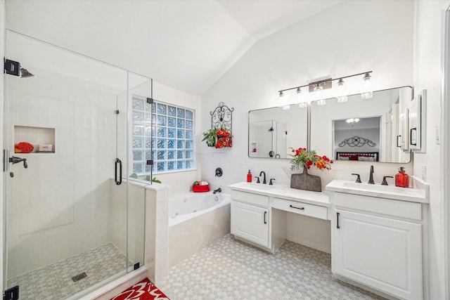 bathroom with vanity, vaulted ceiling, and shower with separate bathtub