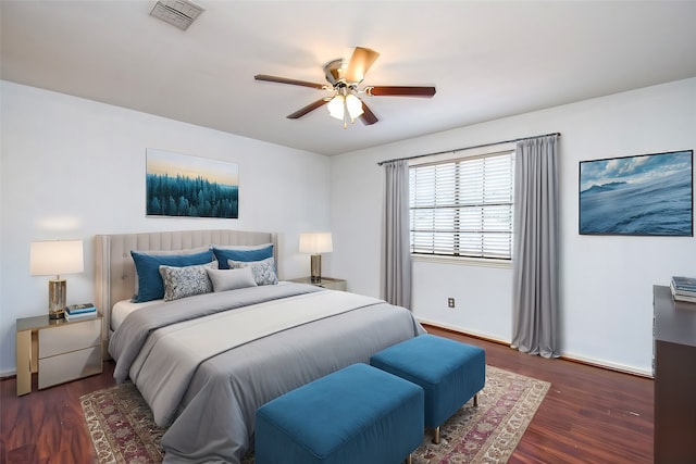 bedroom with dark wood-type flooring and ceiling fan