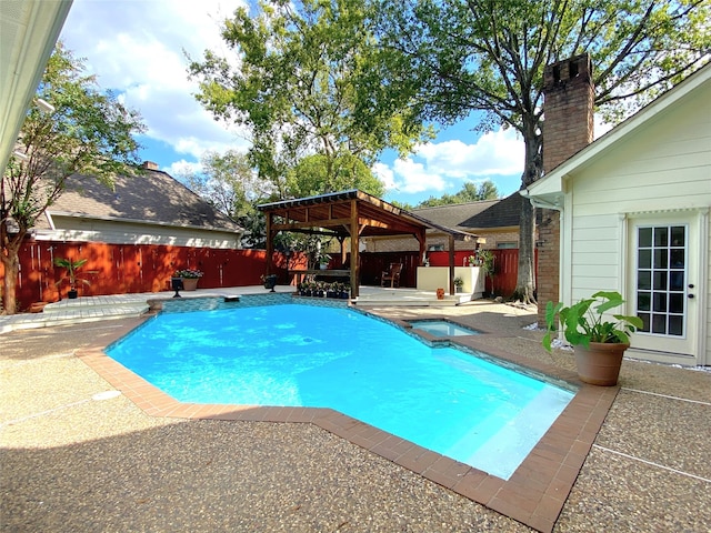 view of swimming pool with a gazebo and a patio