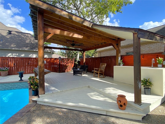 view of patio / terrace with a swimming pool side deck and ceiling fan