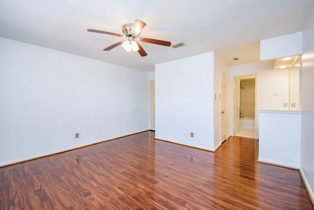 empty room featuring ceiling fan and dark hardwood / wood-style flooring