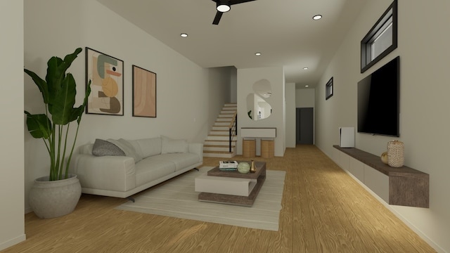 living room featuring light hardwood / wood-style flooring and ceiling fan