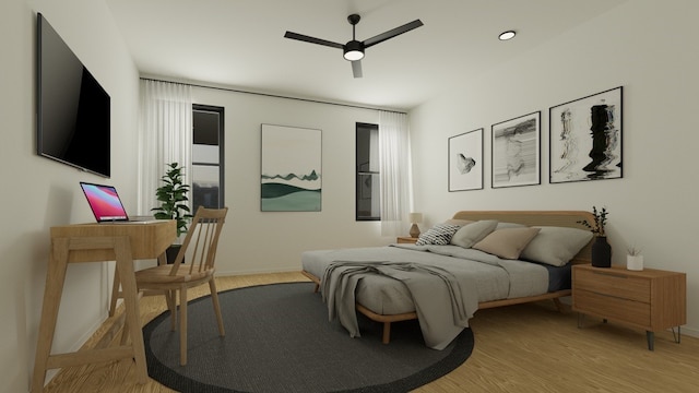 bedroom with light hardwood / wood-style flooring and ceiling fan