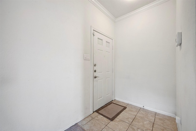 2255 Braeswood Park Dr Unit 184, Houston, TX 77030 - doorway to outside with ornamental molding, light tile patterned floors, and baseboards