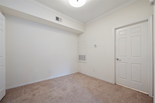 empty room with crown molding and carpet floors