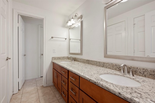 2255 Braeswood Park Dr Unit 184, Houston, TX 77030 - bathroom featuring double vanity, a sink, and tile patterned floors