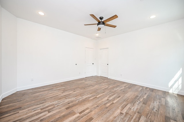 30626 Logger Ln, Magnolia, TX 77355 - empty room featuring ceiling fan, wood finished floors, baseboards, and recessed lighting