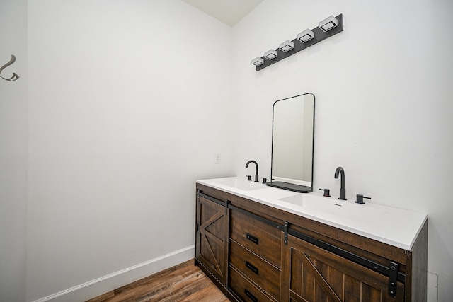 bathroom with vanity and hardwood / wood-style floors