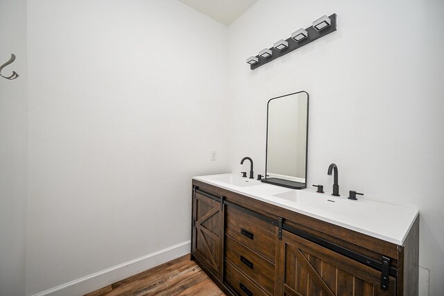 30626 Logger Ln, Magnolia, TX 77355 - full bath with double vanity, wood finished floors, and baseboards