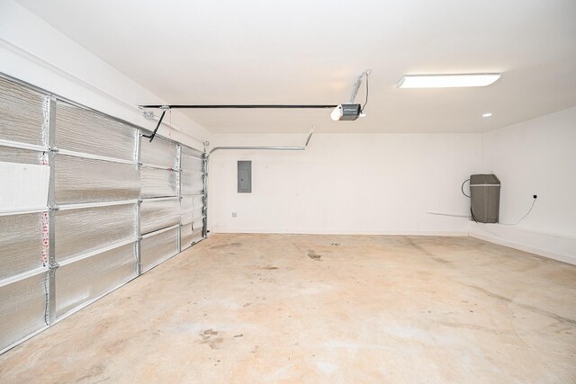 30626 Logger Ln, Magnolia, TX 77355 - garage with electric panel and a garage door opener