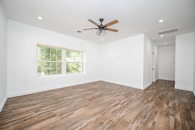 30626 Logger Ln, Magnolia, TX 77355 - spare room with wood finished floors, ceiling fan, baseboards, and recessed lighting