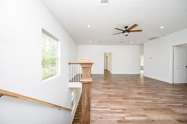 30626 Logger Ln, Magnolia, TX 77355 - unfurnished room featuring a ceiling fan, recessed lighting, plenty of natural light, wood finished floors, and baseboards