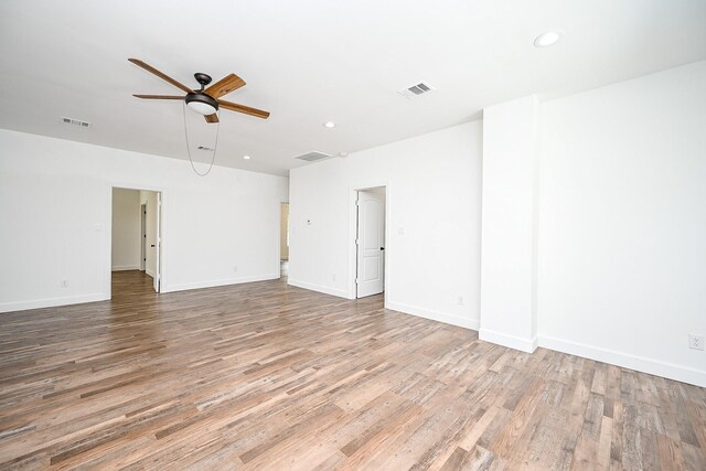 30626 Logger Ln, Magnolia, TX 77355 - unfurnished room with a ceiling fan, wood finished floors, recessed lighting, and baseboards