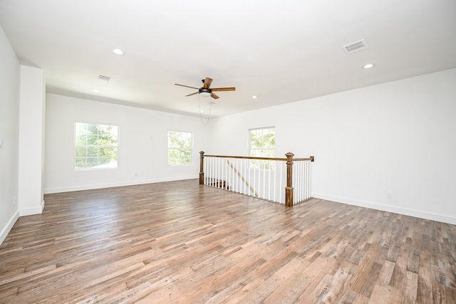 spare room with light hardwood / wood-style flooring and ceiling fan