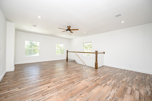 30626 Logger Ln, Magnolia, TX 77355 - spare room with plenty of natural light, wood finished floors, a ceiling fan, baseboards, and recessed lighting