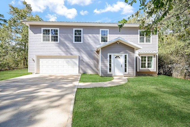 view of front of property featuring a front lawn and a garage