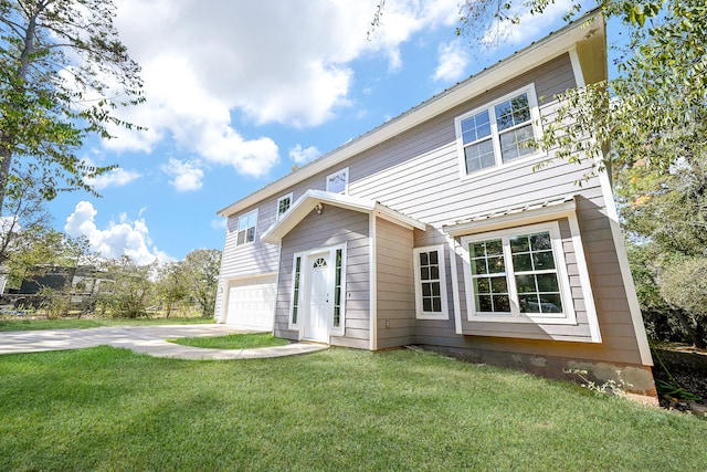 view of front facade with a garage and a front lawn