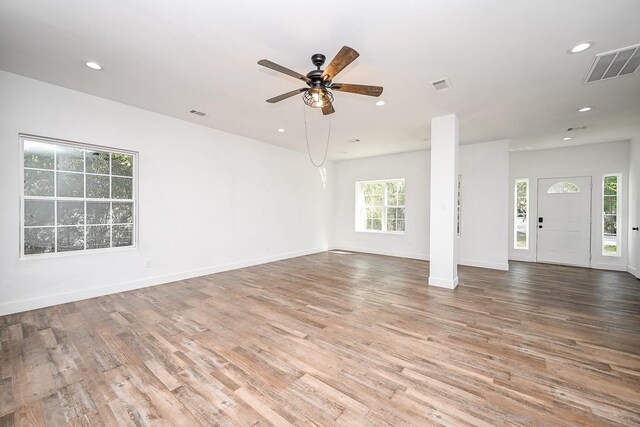 30626 Logger Ln, Magnolia, TX 77355 - unfurnished living room with wood finished floors, recessed lighting, a ceiling fan, and baseboards