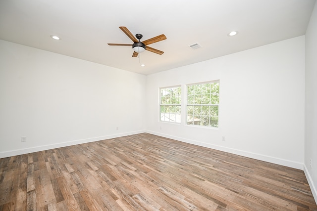 spare room featuring light hardwood / wood-style floors and ceiling fan