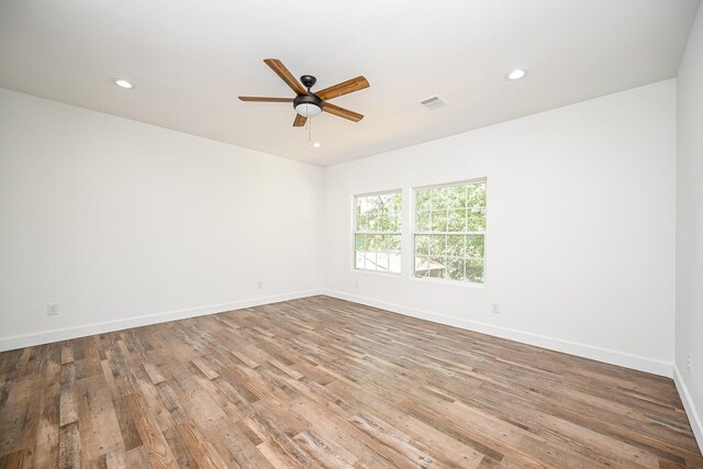 30626 Logger Ln, Magnolia, TX 77355 - empty room with ceiling fan, wood finished floors, baseboards, and recessed lighting