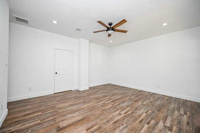 30626 Logger Ln, Magnolia, TX 77355 - empty room with ceiling fan, wood finished floors, baseboards, and recessed lighting