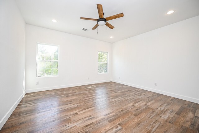 30626 Logger Ln, Magnolia, TX 77355 - unfurnished room featuring a ceiling fan, recessed lighting, wood finished floors, and baseboards