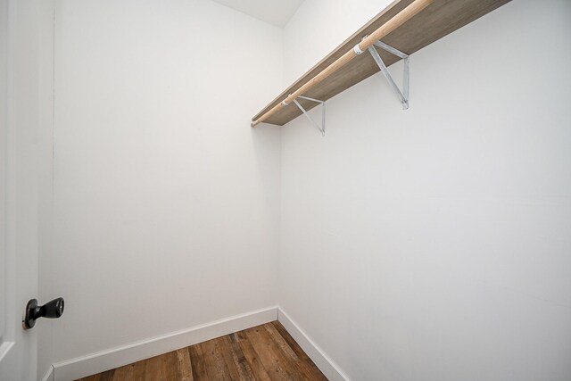30626 Logger Ln, Magnolia, TX 77355 - spacious closet featuring dark wood-type flooring
