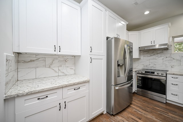 kitchen featuring appliances with stainless steel finishes, tasteful backsplash, white cabinets, and dark hardwood / wood-style flooring