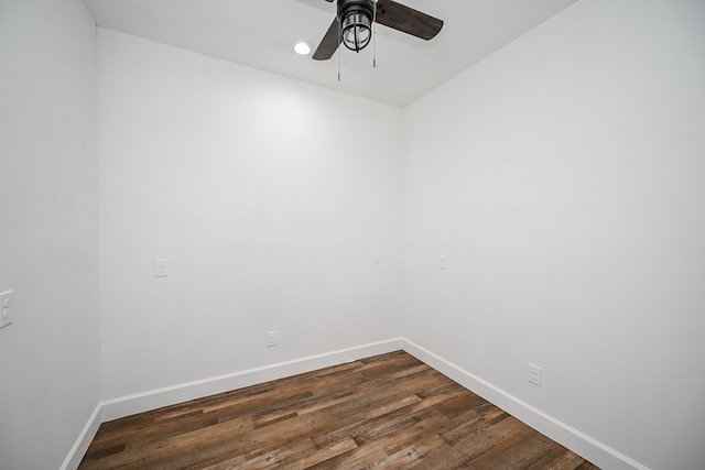 empty room with dark wood-type flooring and ceiling fan