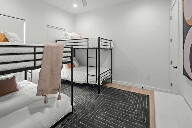 bedroom featuring wood-type flooring and ceiling fan