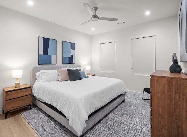 bedroom featuring light hardwood / wood-style floors and ceiling fan