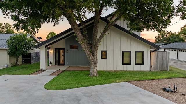 exterior space featuring a yard and a garage