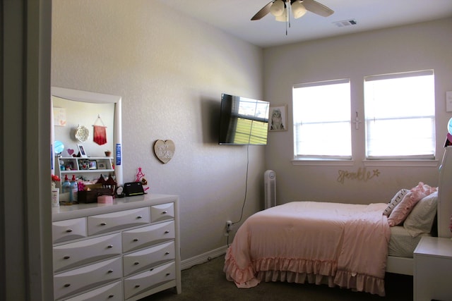 bedroom with radiator, ceiling fan, and carpet floors