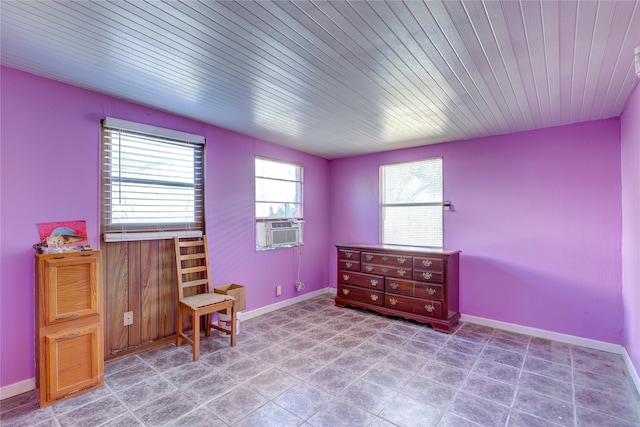 sitting room with cooling unit and wood ceiling