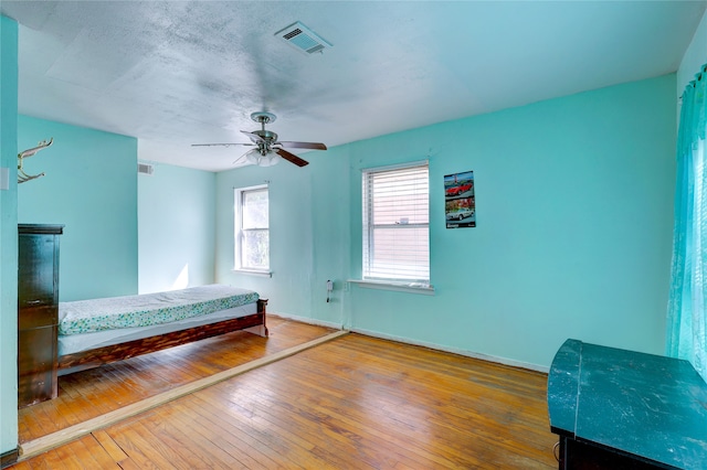 unfurnished bedroom with hardwood / wood-style flooring and ceiling fan