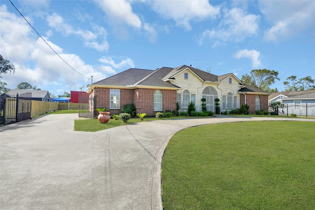 ranch-style house with a front lawn