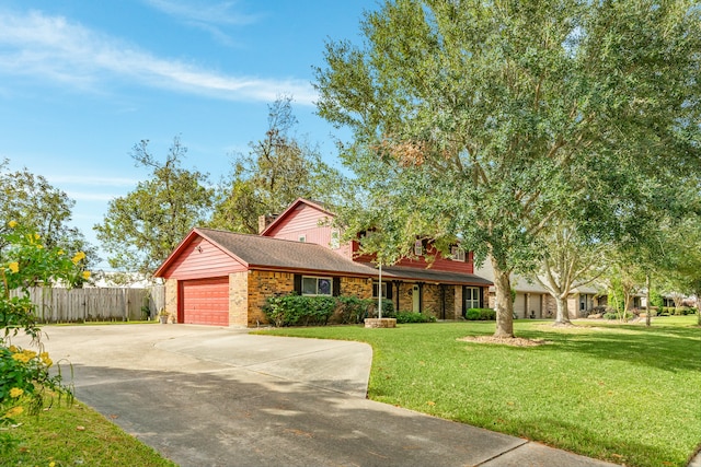 single story home with a front yard and a garage